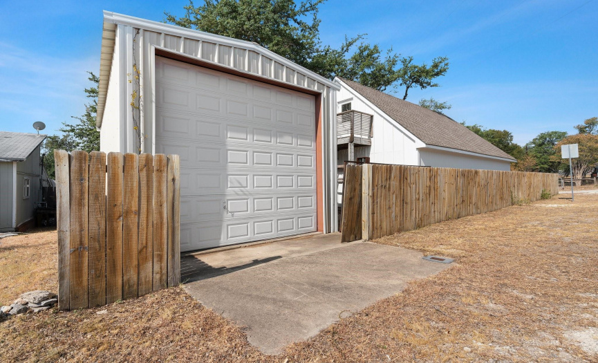 One of the two garage spaces on the property with a 12 ft roll up door and dedicated access off of the road.