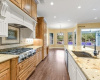 Enjoy the showcase kitchen with a designer hood vent over the cooktop.