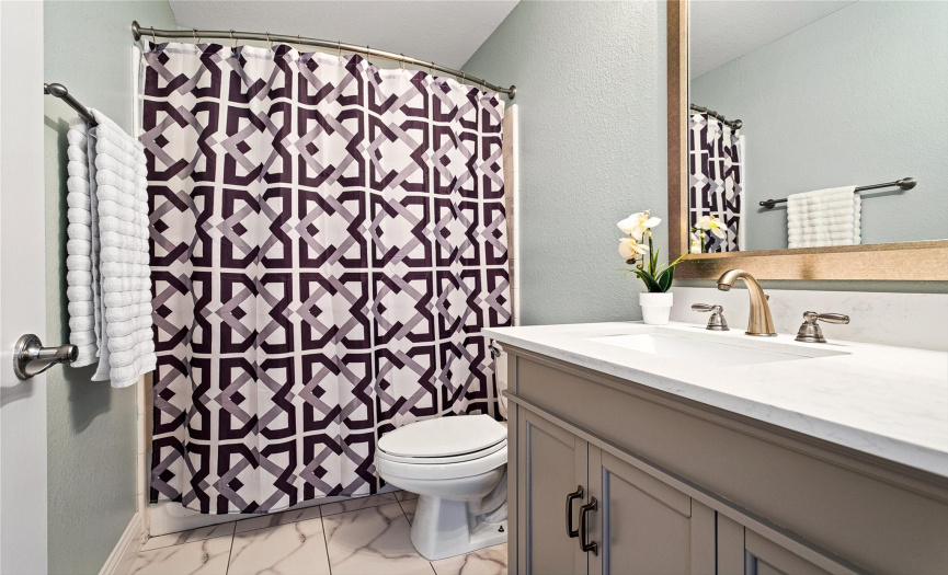 Updated full-sized bathroom perfectly located between the office and guest bedroom for added convenience.