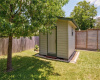 Detached storage shed in back yard.  Great storage space (in addition to the garage) or consider converting to a detached office or studio. *exterior photos taken prior to current drought and COA water restrictions*