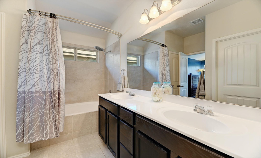 Enjoy your own private ensuite bathroom complete with dual vanity and shower/tub combo with gorgeous tile surround & tile flooring. 