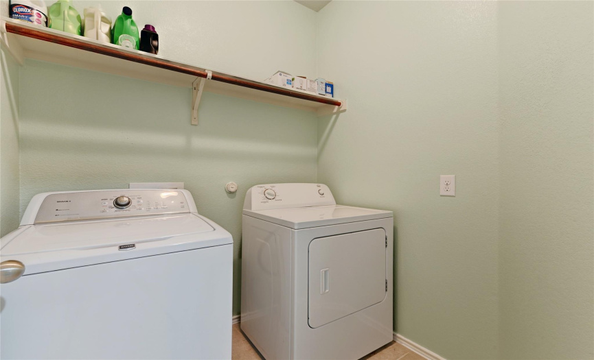 The in-home laundry room is situated off the secondary bedroom hallway. 