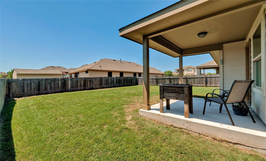 The covered back porch is perfect for BBQ parties and relaxing in the shade.
