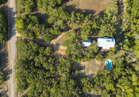 Tucked in the trees, 13601 Paisano Trail offers privacy and tranquility, just minutes to town.