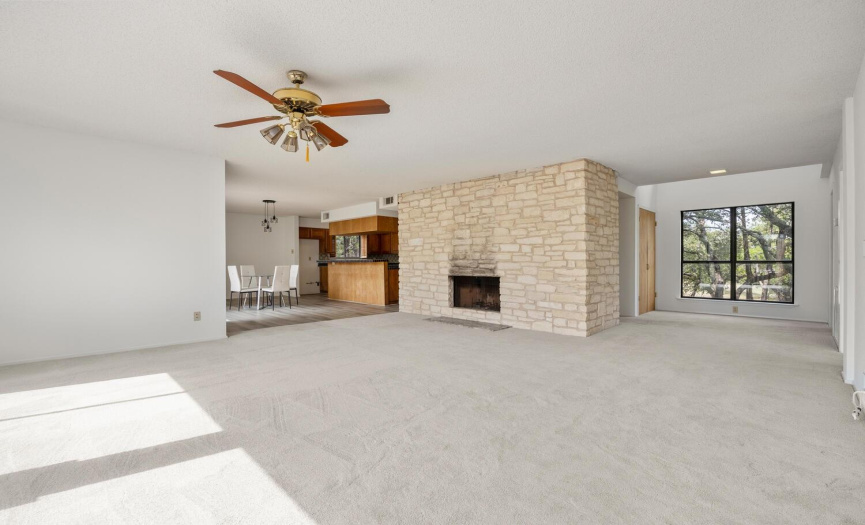  Providing a pillar of strength, the massive three story stone fireplace is literally the heart of the home. 