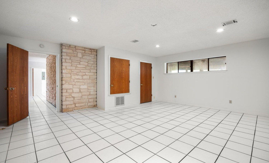 This room on the ground floor can be used as a bedroom, home office, game room...there are two additional closets just out of view.