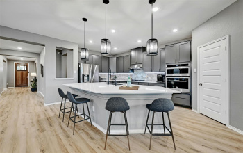 Is this your dream kitchen?  Oh yes, it is! Time to elevate your cooking and entertaining experience! Welcome to 1116 Euless Ln. 