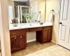 Primary Bathroom features dual vanities, garden tub, separate shower, and a large walk-in closet