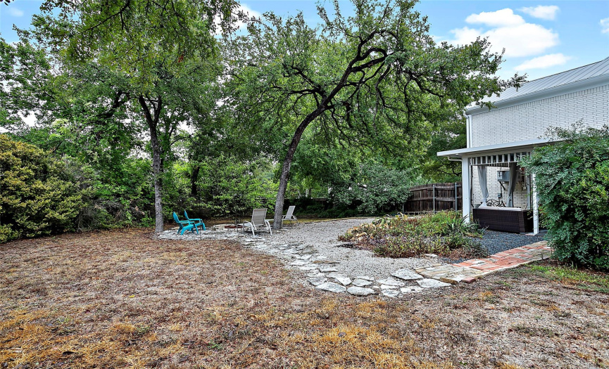 Don't miss the fire pit in the backyard. There is so much potential with this oversized lot!