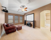 This second living space is complete with surround sound audio, projector, screen and ceiling fan. 