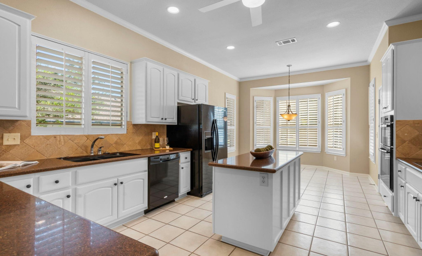 The breakfast nook is the perfect place for casual dining or your morning cup of coffee. It has wonderful views of the front yard with its beautiful landscaping and mature trees.