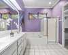 The primary bathroom offers dual vanities, generous storage, a garden tub and separate shower. 