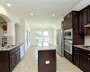 Amazing kitchen with built in oven and microwave and gas cooktop stove.