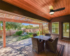 Look at the wood work on this amazing back covered patio!