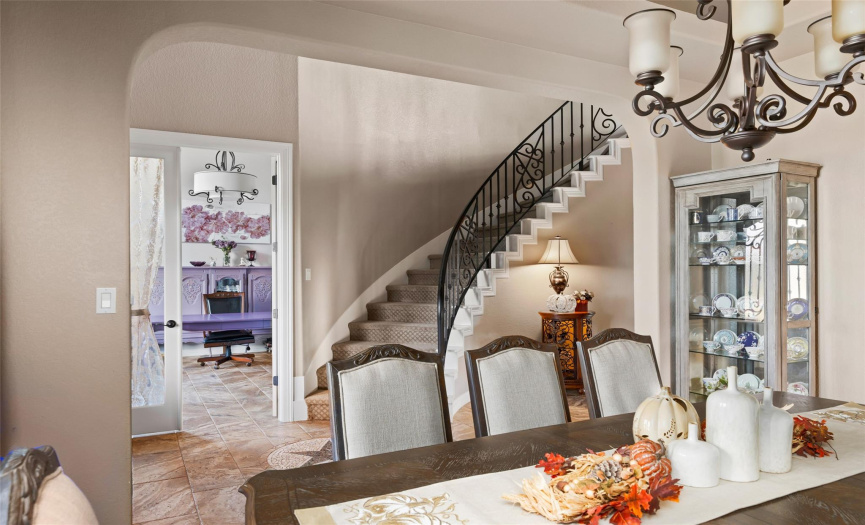 The beautiful curved staircase welcomes visitors into the home.