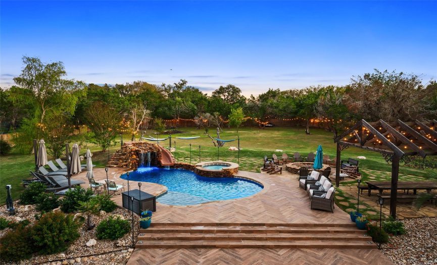 The backyard is a true oasis, featuring incredible relaxation and entertaining space, and abundant privacy.
