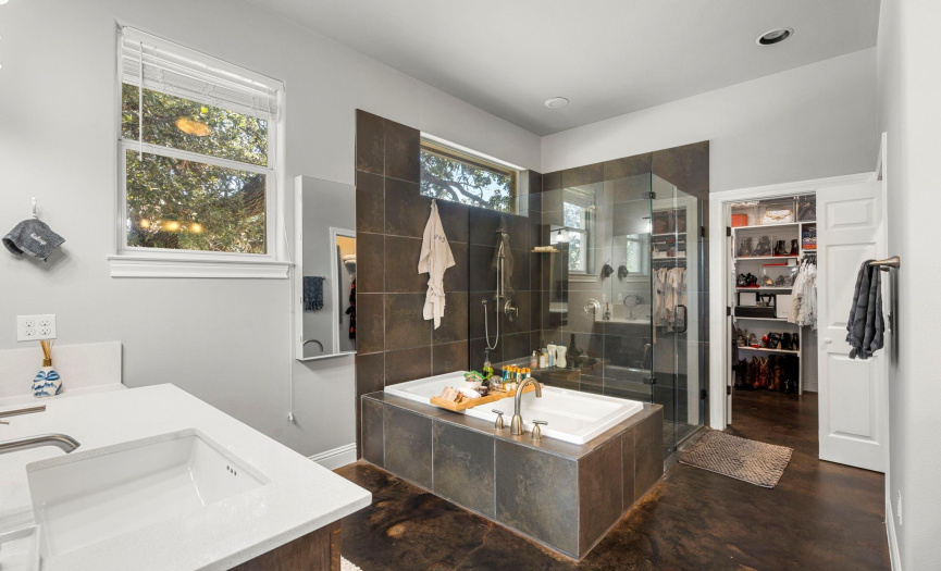 This primary en-suite bathroom is your own private spa.  Separate vanities, soaking tub, separate shower and walk in closet.  