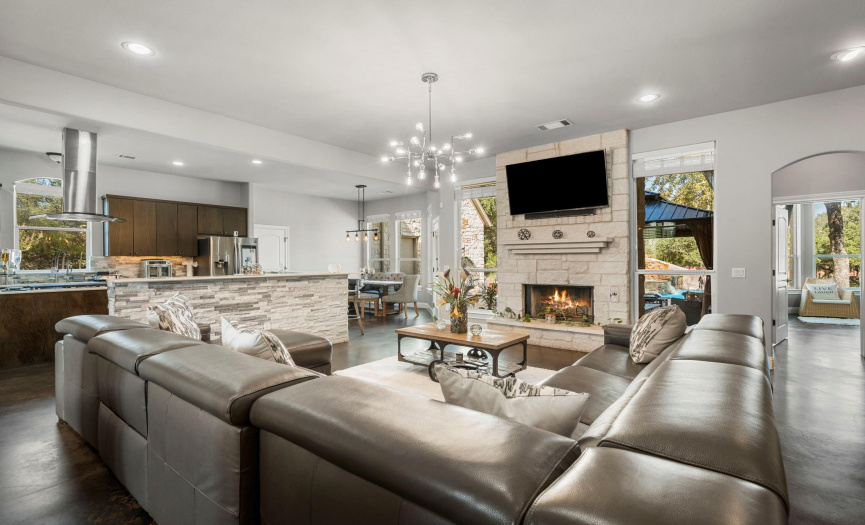 Family room is the heart of the home and what a beautiful space this is.  Open space that overlooks the oasis of a back yard and just off of the chef inspired kitchen. 