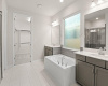 Primary suite bath with dual vanities