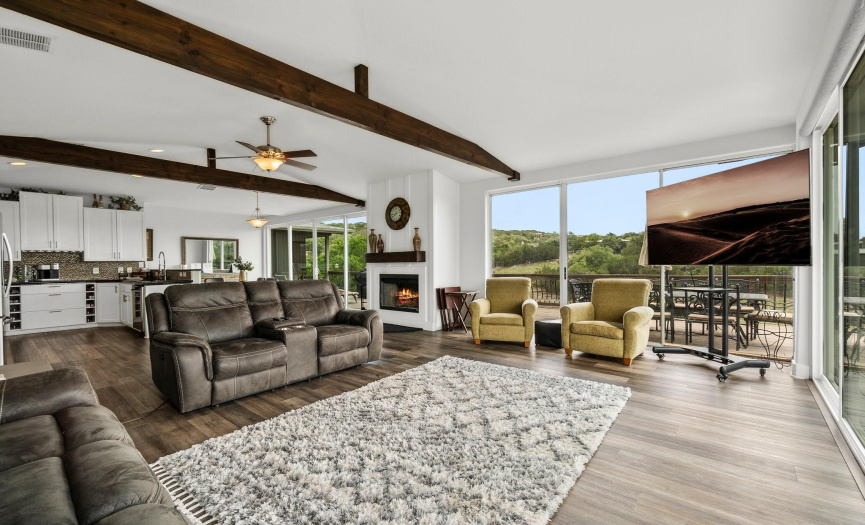 The high ceilings and the beautiful beams make you really want to stay here and call this place home! There are recently purchased remote shades in the garage that fit the windows. 