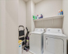 Laundry room upstairs, the washer and dryer convey