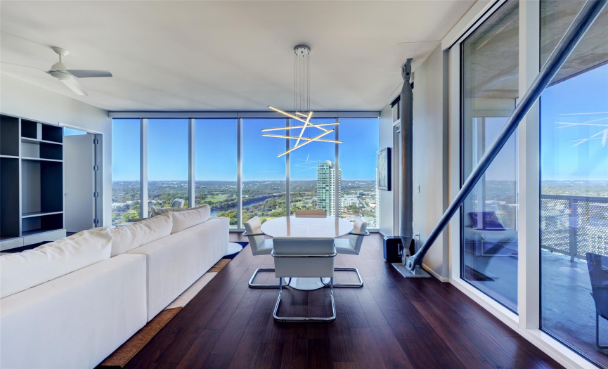 Living and dining room overlooking Lady Bird Lake and Hill Country.