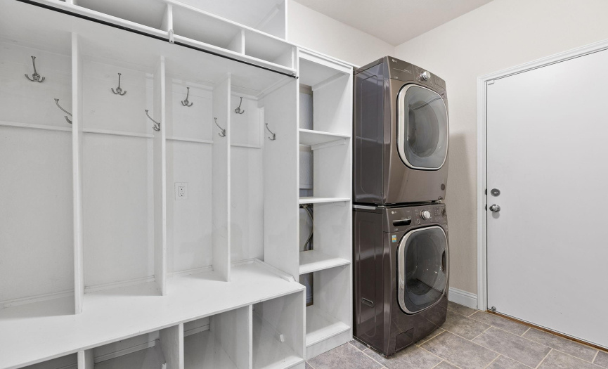 Laundry Room features shelving and the washer and dryer are included with the home. 