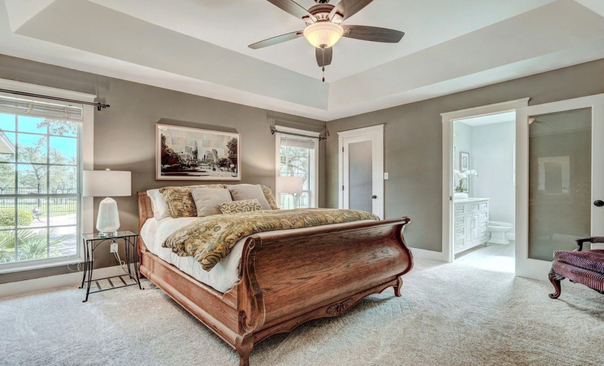 Master bedroom with fresh carpet and paint, cove ceiling, walk in closet and updated ensuite bath.