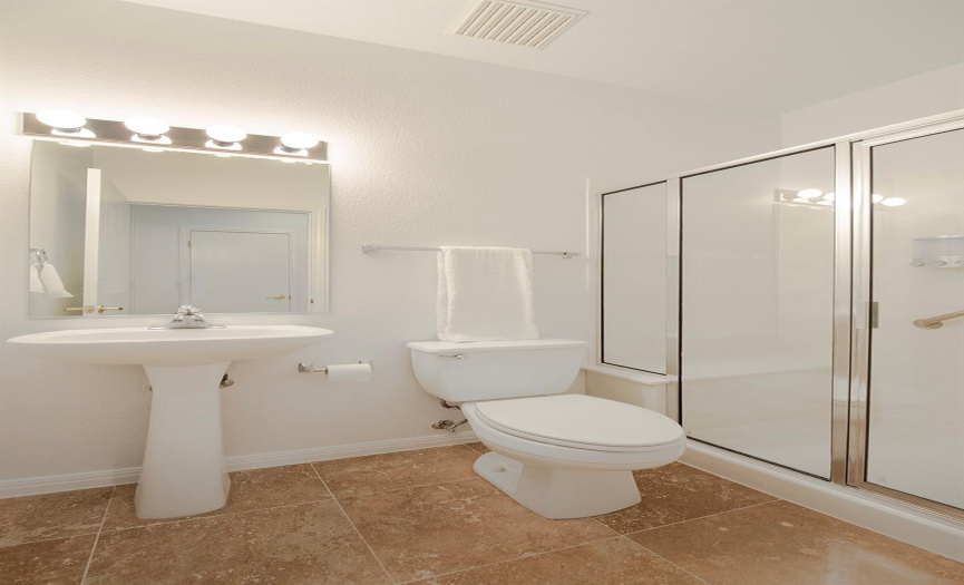 11- A Pedestal sink in the hall bath with a walk-in Shower