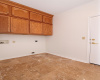 12- The indoor Utility-Laundry includes ample cabinetry