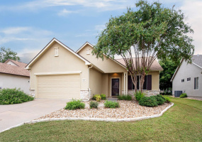 1 -Welcoming Front view of Home with Lantana in bloom by the Double Car Garage