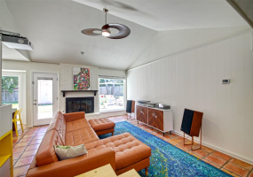 Large secondary living space with portrait window, vaulted ceilings and lots of natural light!