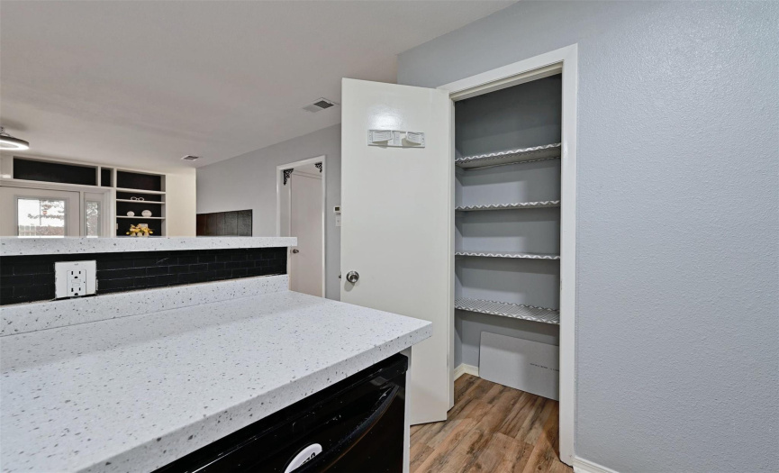 A sizable pantry is set adjacent to the kitchen.