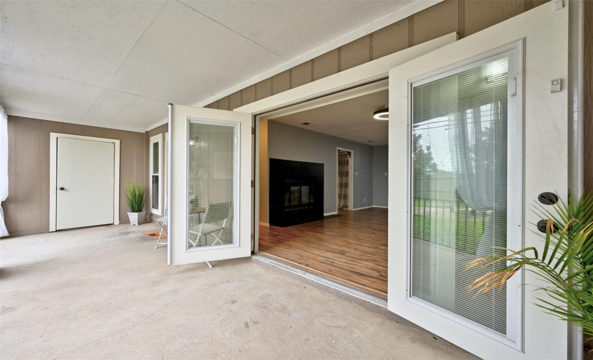 The stunning french doors open the home to fresh air on the front patio.