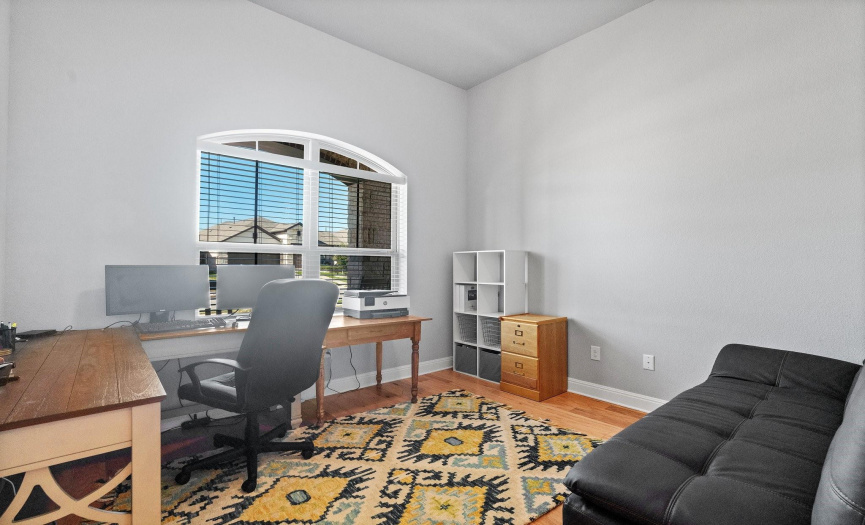 The main floor also hosts a versatile home office/flex room, providing the ideal space for work or creative pursuits.