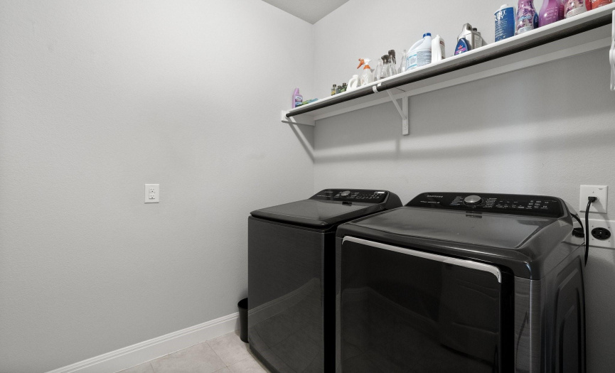 The laundry room combines practicality with style, making chores a breeze in this well-designed space.