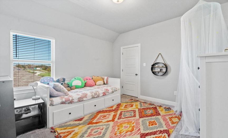 Another beautifully designed bedroom provides a cozy retreat with ample space and natural light.