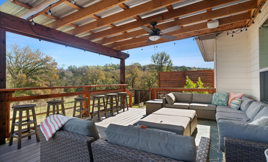 Step outside onto the new Trex composite deck, a perfect space for entertaining friends or simply enjoying the serene greenbelt views.