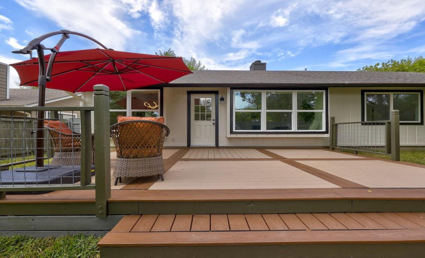 The deck's spaciousness allows for comfortable seating arrangements and outdoor dining