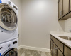 stacked washer/dryer convey,  utility sink