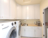 Large Laundry Room with plenty of storage space.
