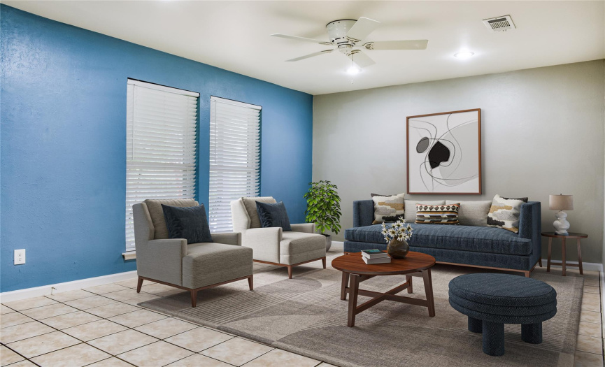 Family Room has Hard Tile Flooring, Large Windows and Ceiling Fan