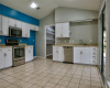 Stainless Appliances, White Cabinetry and Abundance of Couter-Space