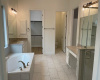 Primary bath -dual vanities, separate tub and walk-in closet and 