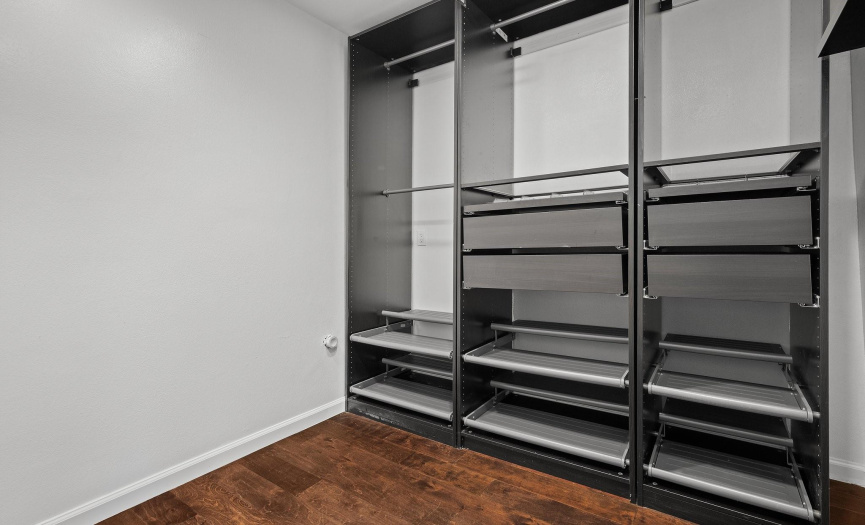 The walk-in closet features an awesome Elfa organizational system that is sure to impress!