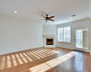 Living area, fireplace, freshly repainted, backyard view & doorway
