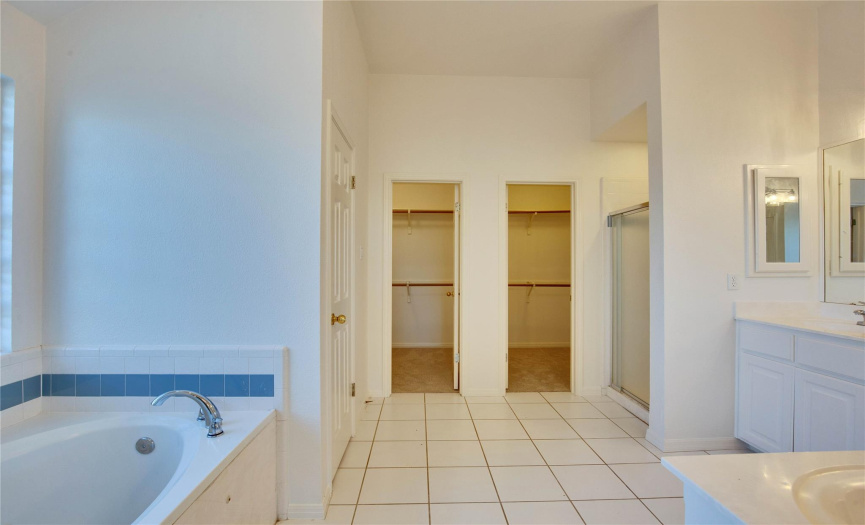 Primary bathroom, separate shower, private door to toilet, dual spacious walk-in closets