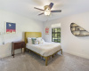 Nice size guest bedroom with good natural light and ceiling fan.