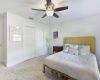 Nice size guest bedroom with good natural light and ceiling fan. 