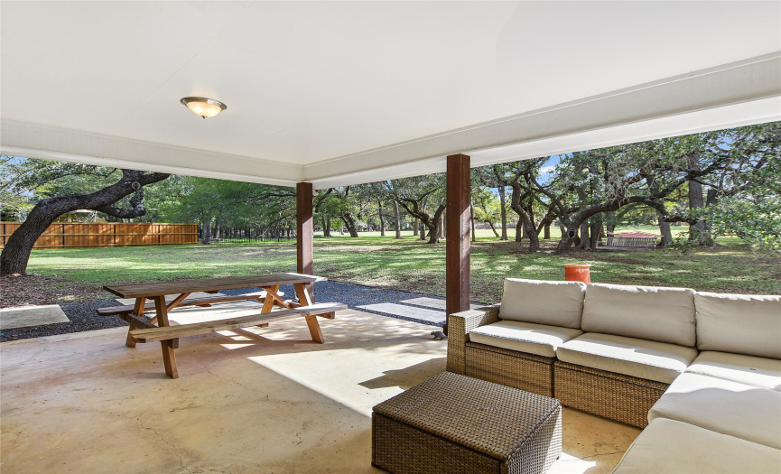 Very nice covered patio open to the big back yard and golf course.